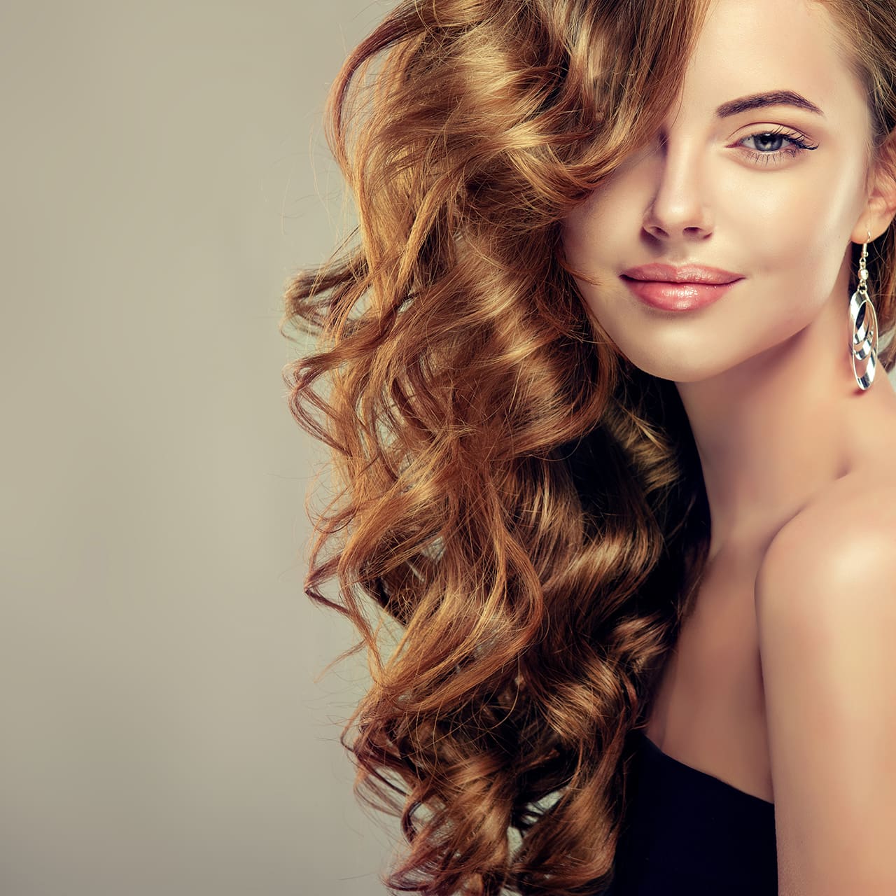 Beautiful girl with long wavy hair . Brunette with curly hairstyle ...